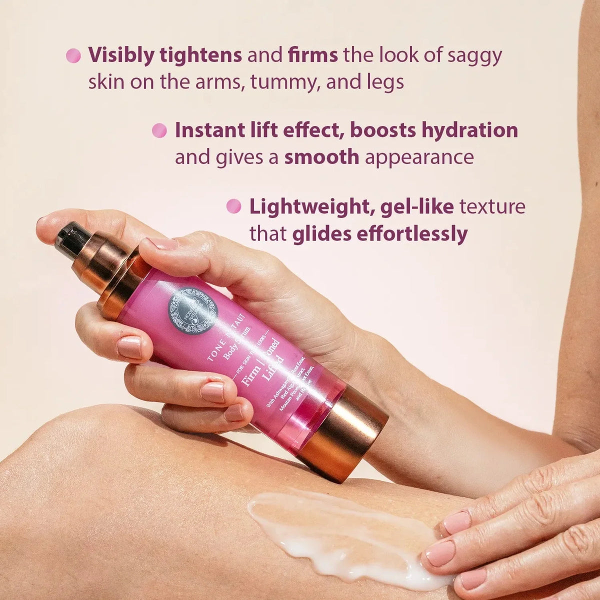 Tone N Taut Body Serum: a hand holding the bottle while another hand spreads the white serum on a leg. Visibly tightens and firms the look of saggy skin on the arms, tummy, and legs. Instant lift effect, boosts hydration and gives a smooth appearance. Lightweight, gel-like texture that glides effortlessly